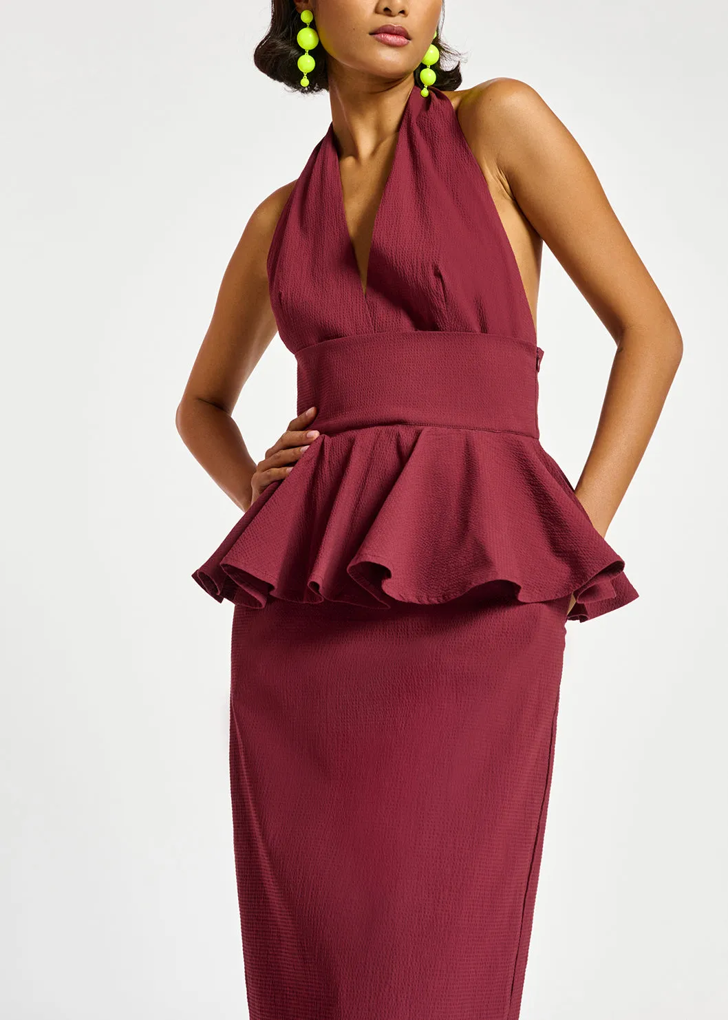 Burgundy halterneck dress with peplum