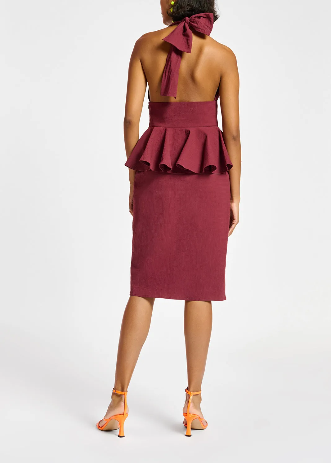 Burgundy halterneck dress with peplum