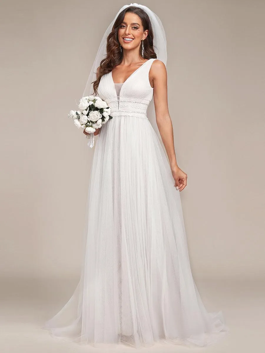 Robe de mariée longue sans manches en V profond et dos bas
