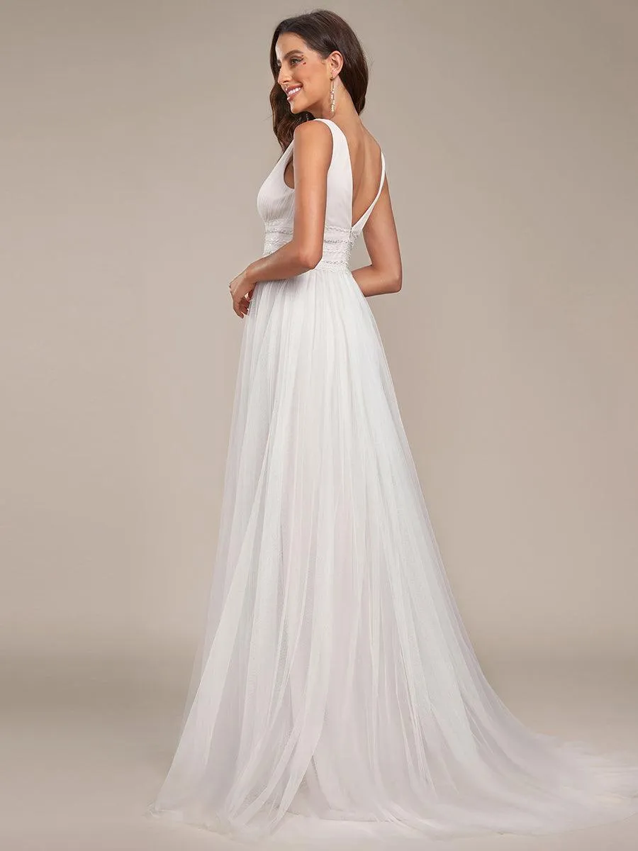 Robe de mariée longue sans manches en V profond et dos bas