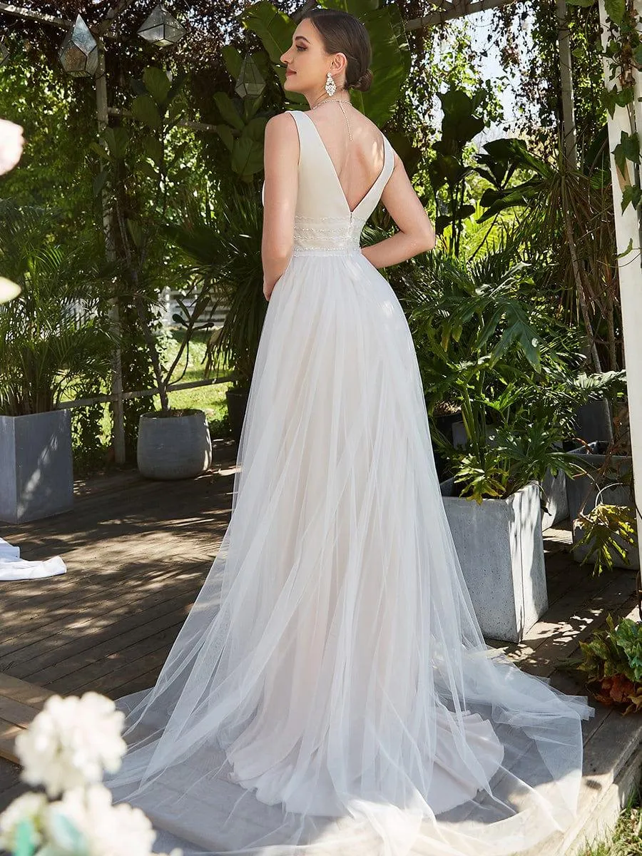 Robe de mariée longue sans manches en V profond et dos bas