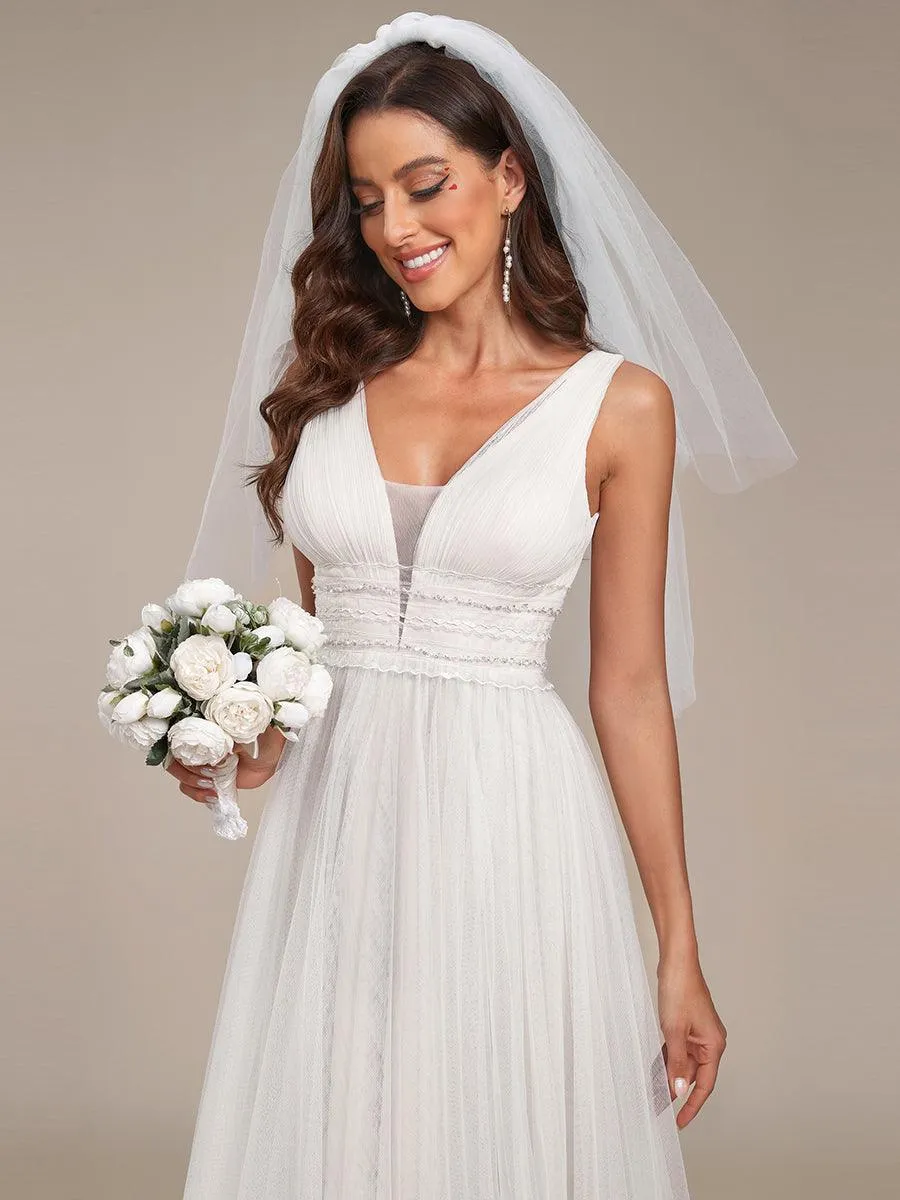 Robe de mariée longue sans manches en V profond et dos bas